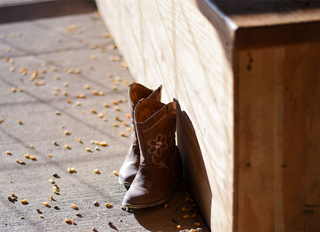 A child's pair of boots rest